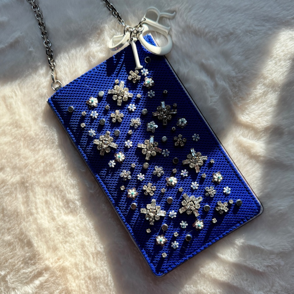 Authentic Dior Stardust Phone Pouch with a removable chain.